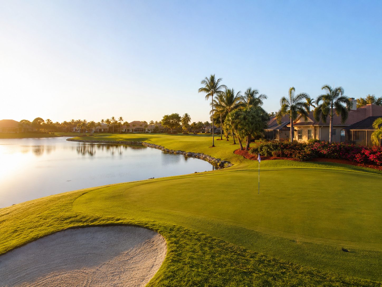 The 18th green and bunkers at golden hour in Fairway Estates